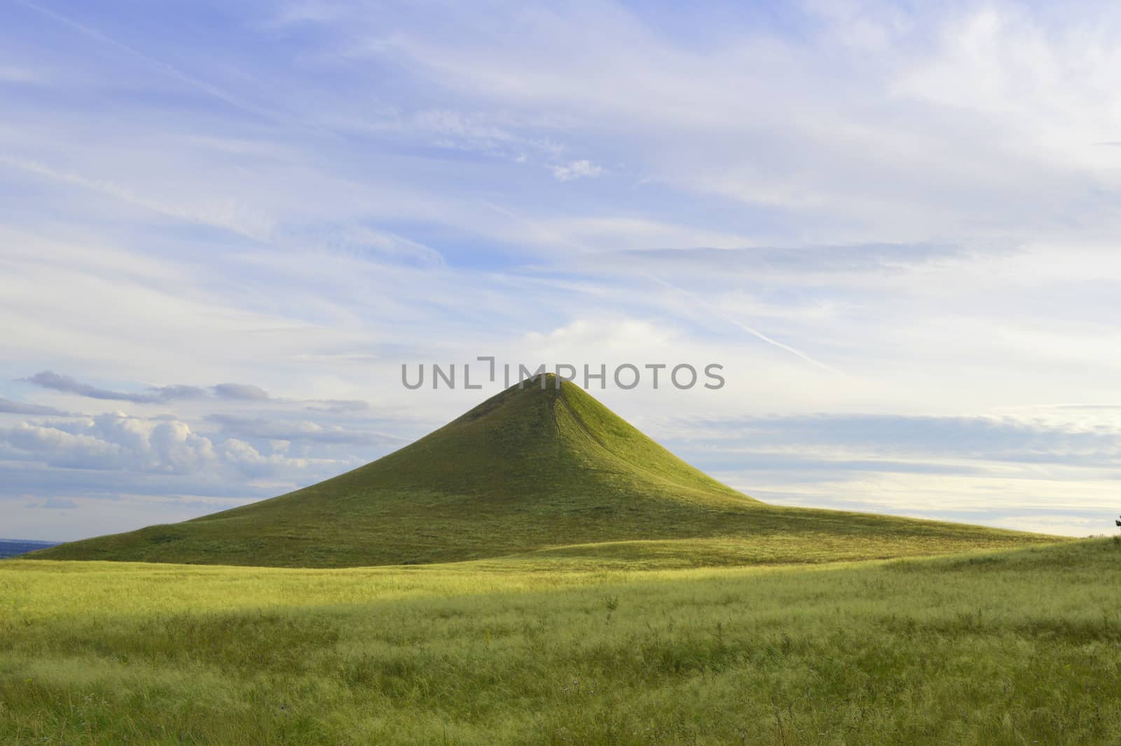 summer landscape with mountain and blue sky with clouds