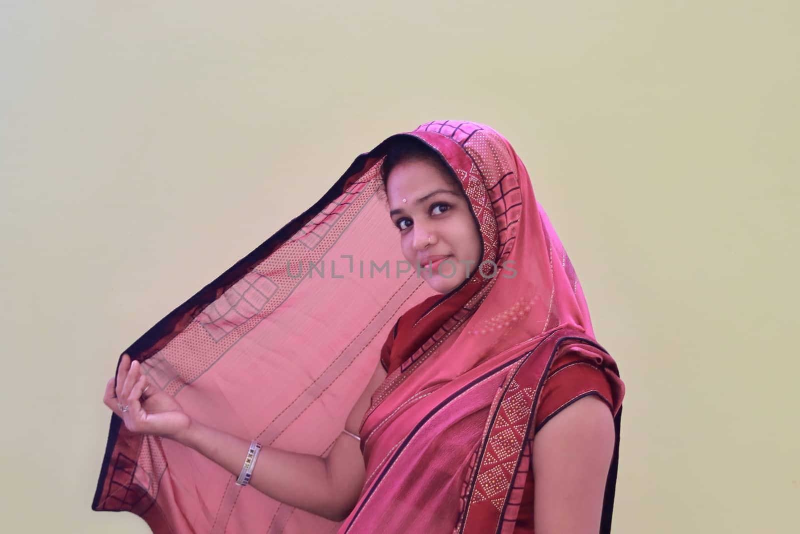 An asian girl in saree with white background