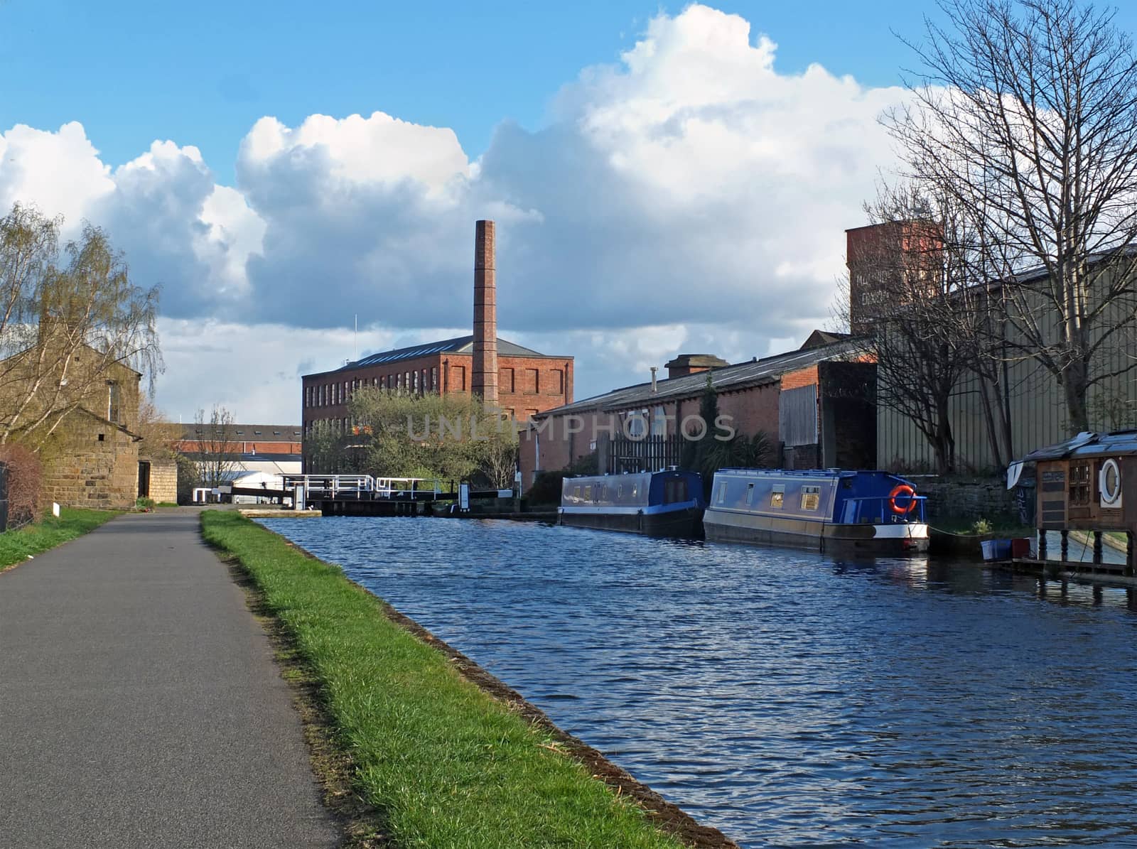 oddy locks on the leeds to liverpool canal with the historic castleton mill in the background