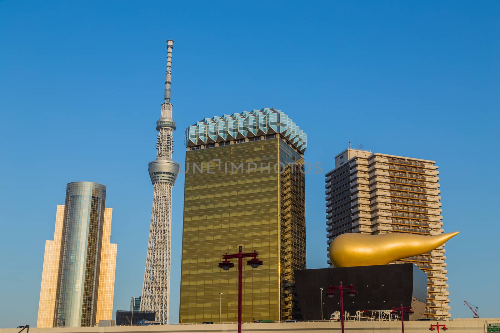 Tokyo. Japan: Asahi Beer buildings. Sunny day. Blue sky. Asahi Breweries headquarters building with the Asahi Flame