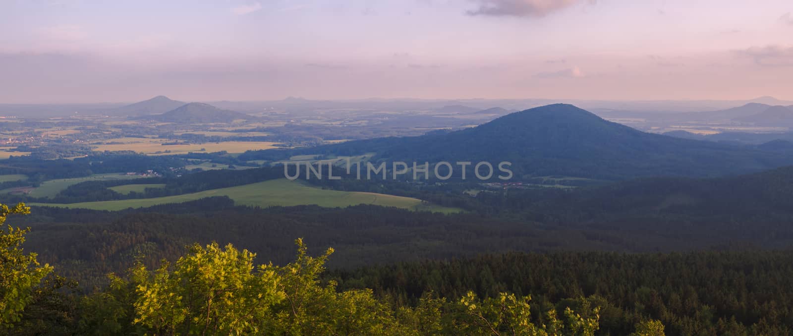 Lusatian Mountains (luzicke hory) wide panorama, panoramic view from Hochwald (Hvozd) mountain on czech german borders with blue green hills forest and pink cloudy sunset sky background by Henkeova