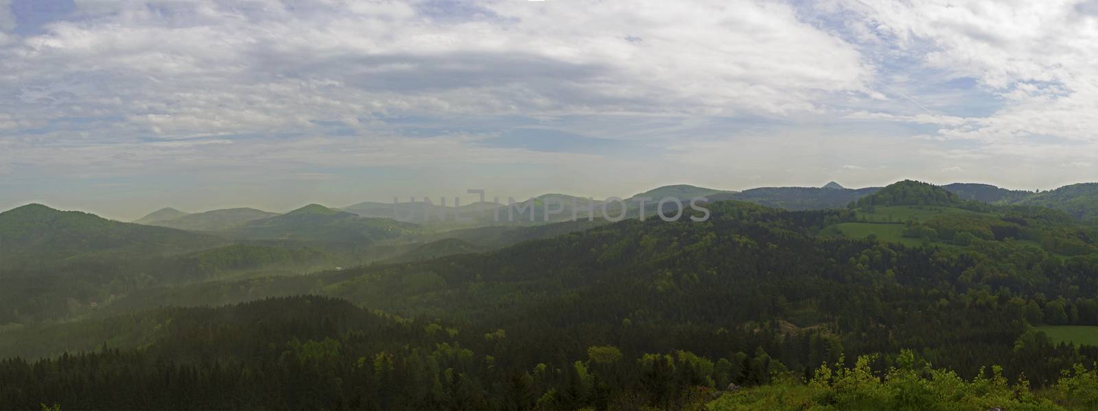 luzicke hory mountains wide panorama, skyline view from hill stredni vrch, green forest and blue sky, white clouds background