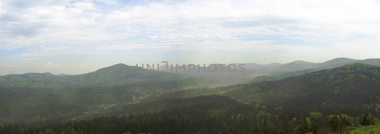 luzicke hory mountains wide panorama, skyline view from hill stredni vrch, green forest and blue sky, white clouds background