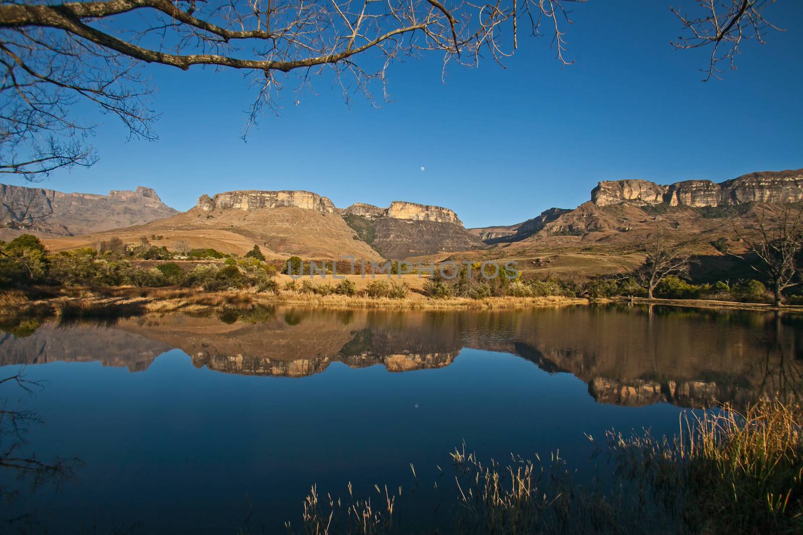 Peaks reflected in a calm mountain lake, Royal Natal National Park. KwaZulu-Natal. South Africa