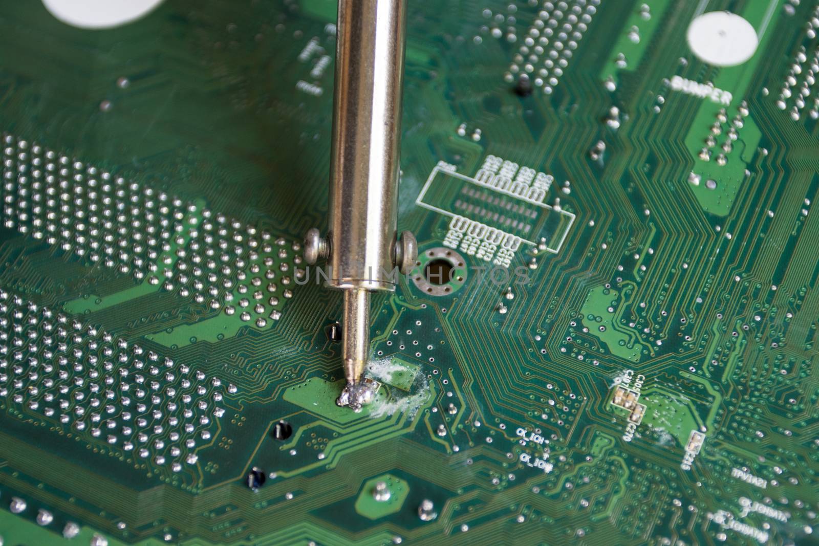 soldering iron for repairing electronic of the computer circuit board concept technology of computer circuit hardware