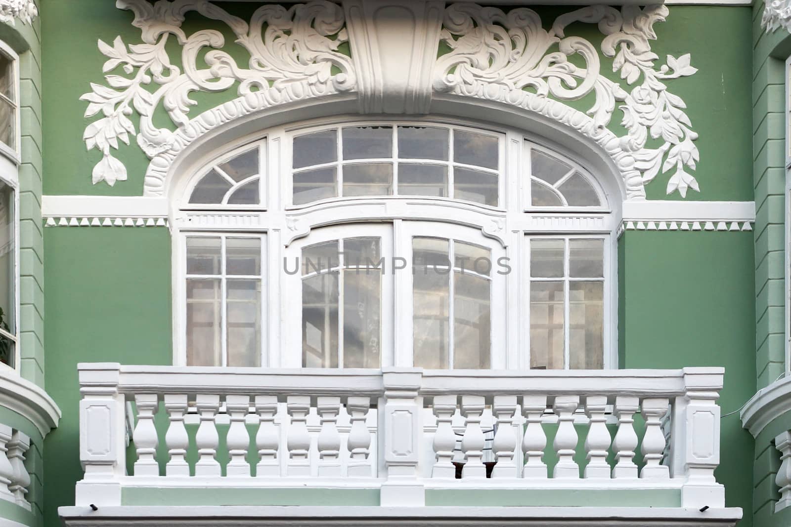 balcony on the old facade with stucco by Annado