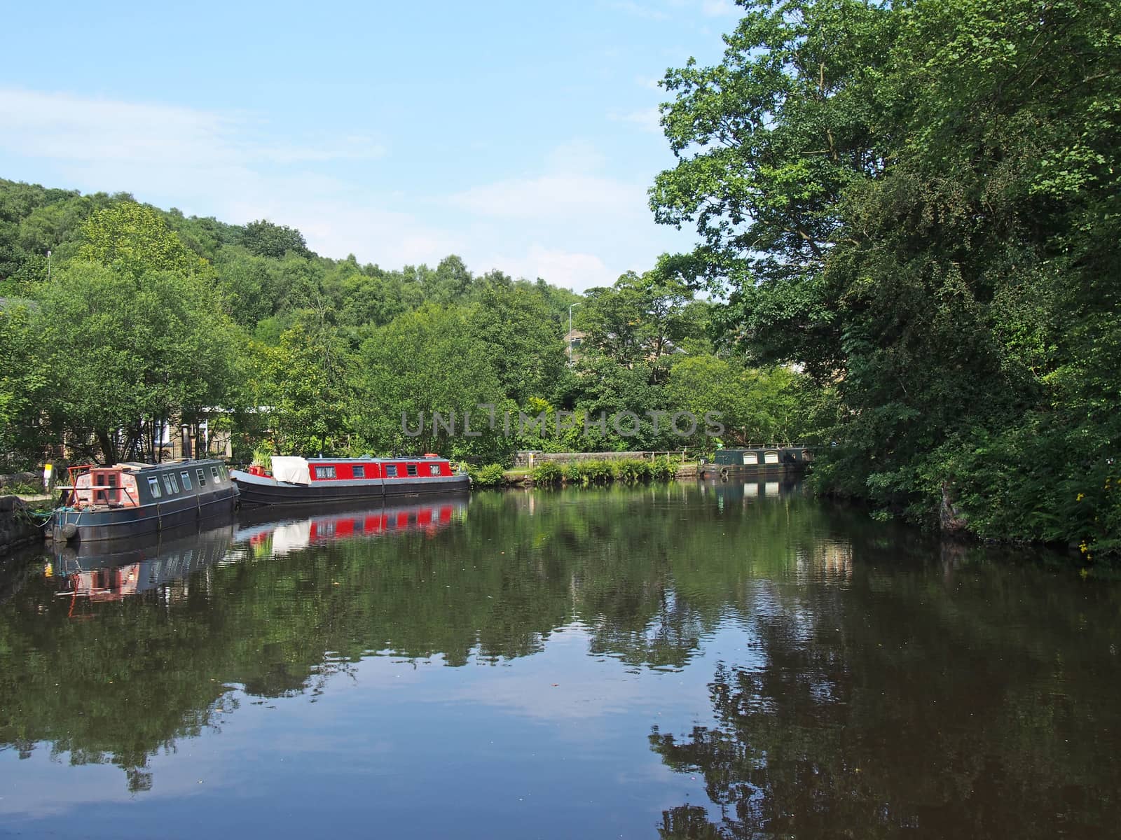 traditional barges moored on the rochdale canal surrounded by calder valley countryside near hebden bridge west yorkshire