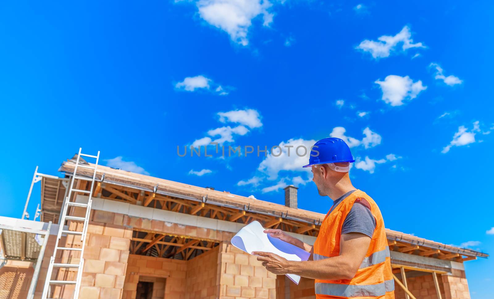inspection of the construction project, manager on the construction of a family house. copy space by Edophoto