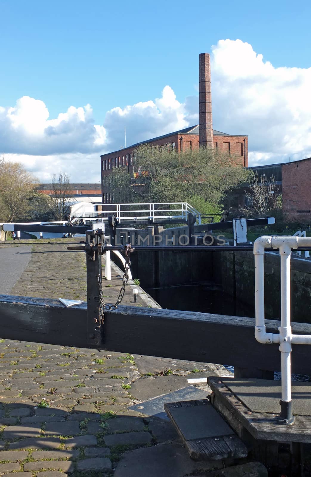 oddy locks on the leeds to liverpool canal with the historic castleton mill in the background