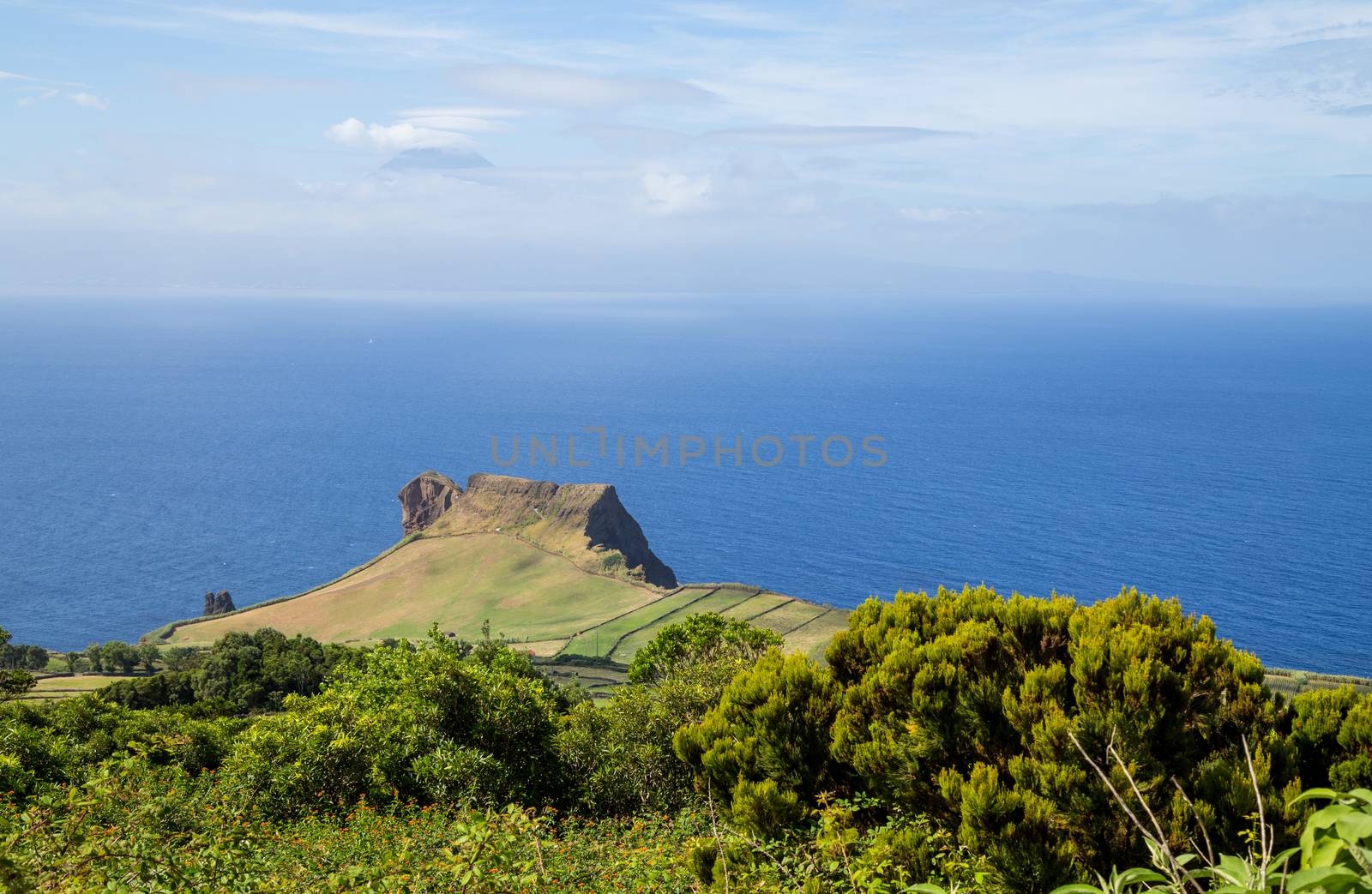 View of the Sao Jorge countryside with the Pico island on the background. Azores, Portugal