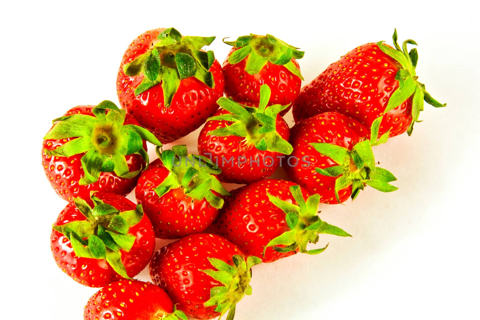 Berries are large and ripe strawberry on a white background by Grommik