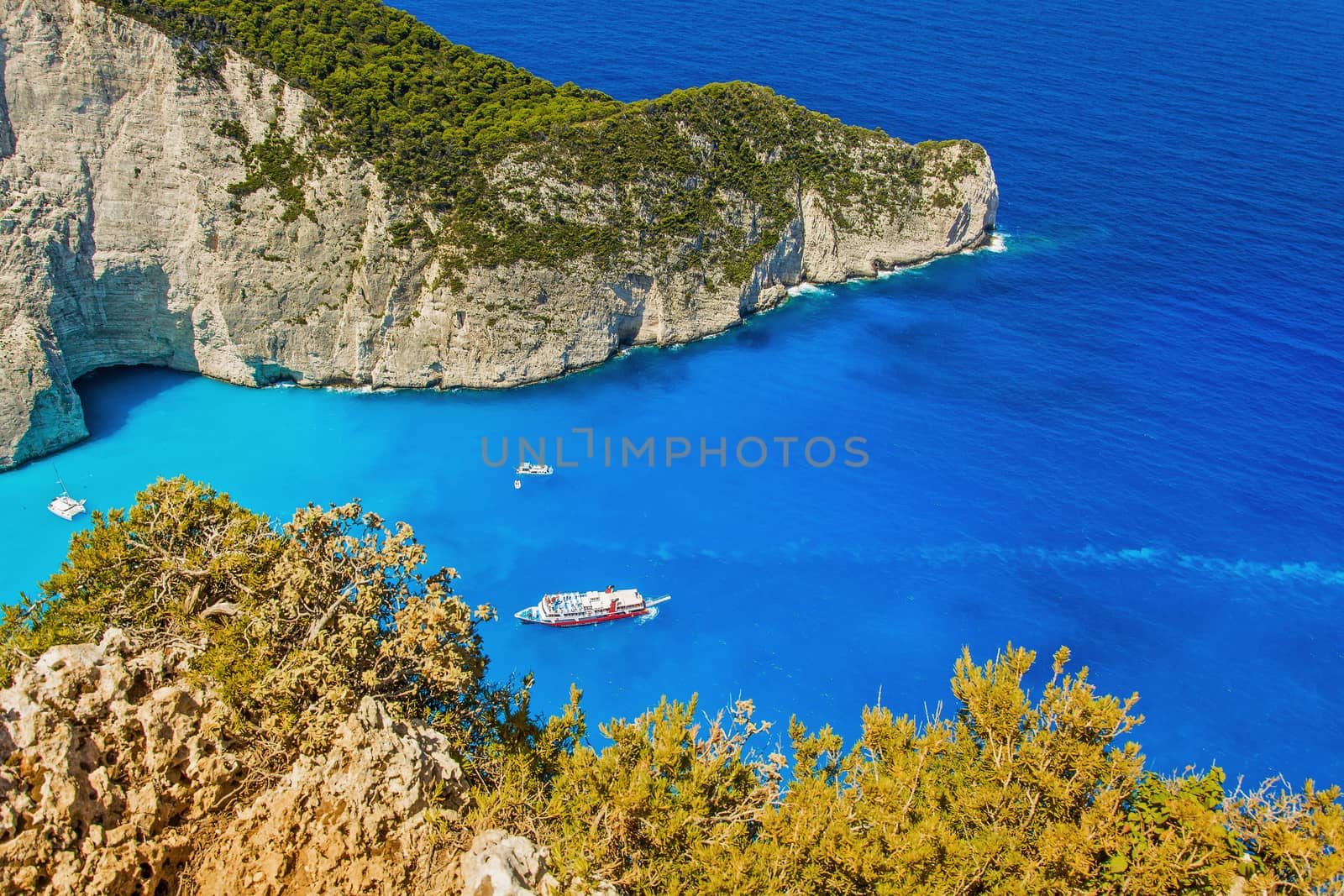 Tourist boat entering the bay on the island of Zakynthos Navajo  by Grommik