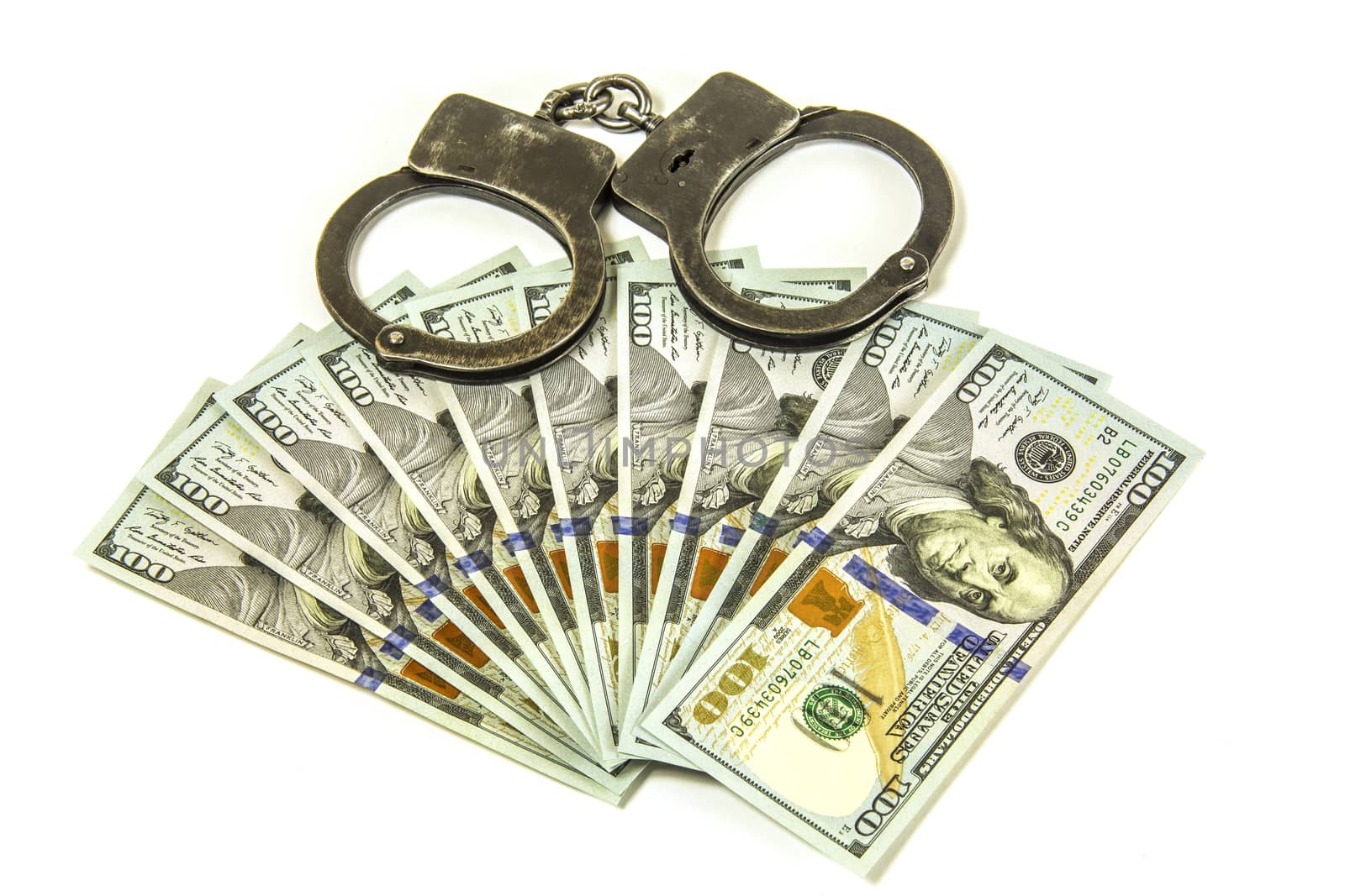 American dollars and metal handcuffs

