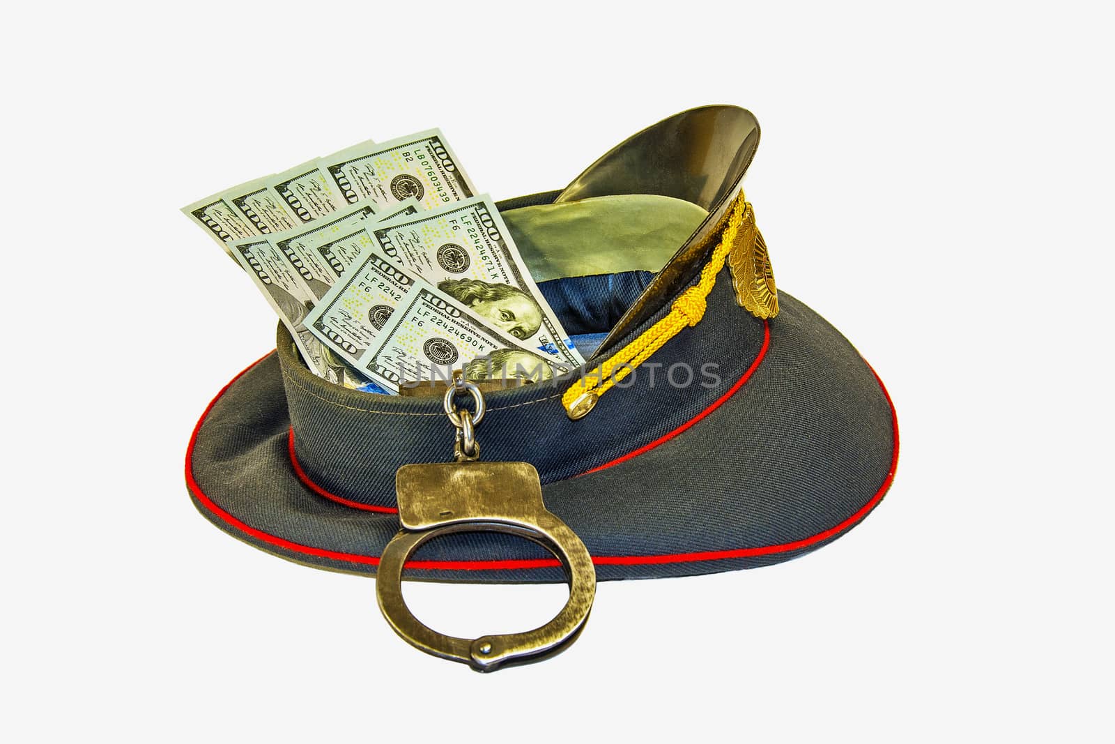 Uniform caps in dollars and in handcuffs
