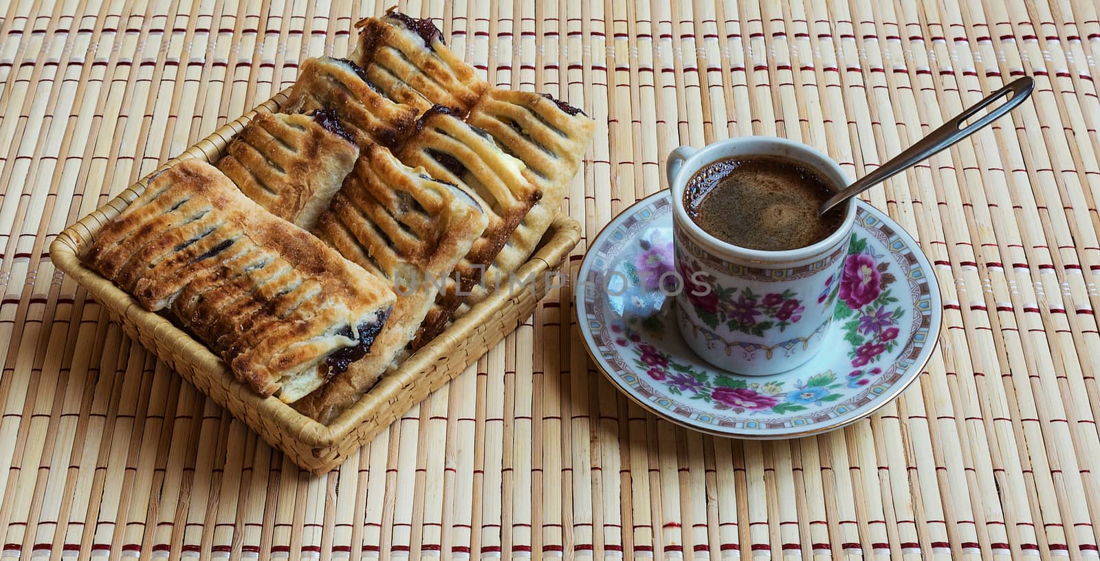 A cup of fresh black coffee and fragrant puff with berries by Grommik