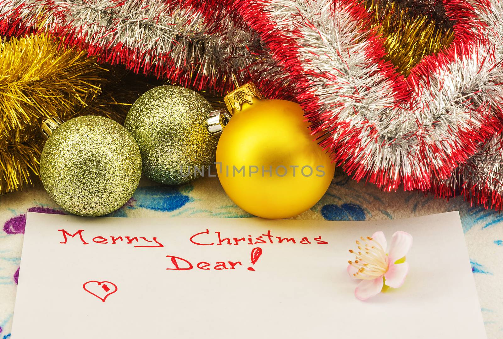 Congratulations on Christmas written in red on a sheet of paper. by Grommik