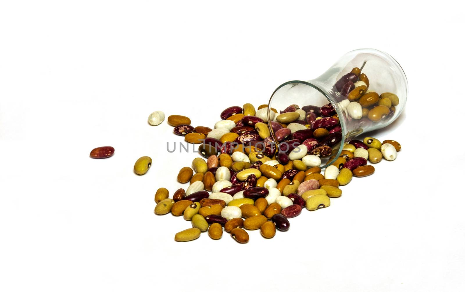 Beans beans scattered from a glass beaker on a white background by Grommik