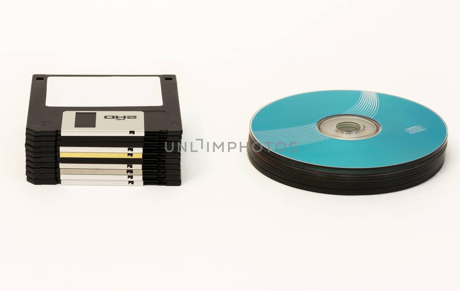 On a white background are black floppy disks and CD / DVD disk