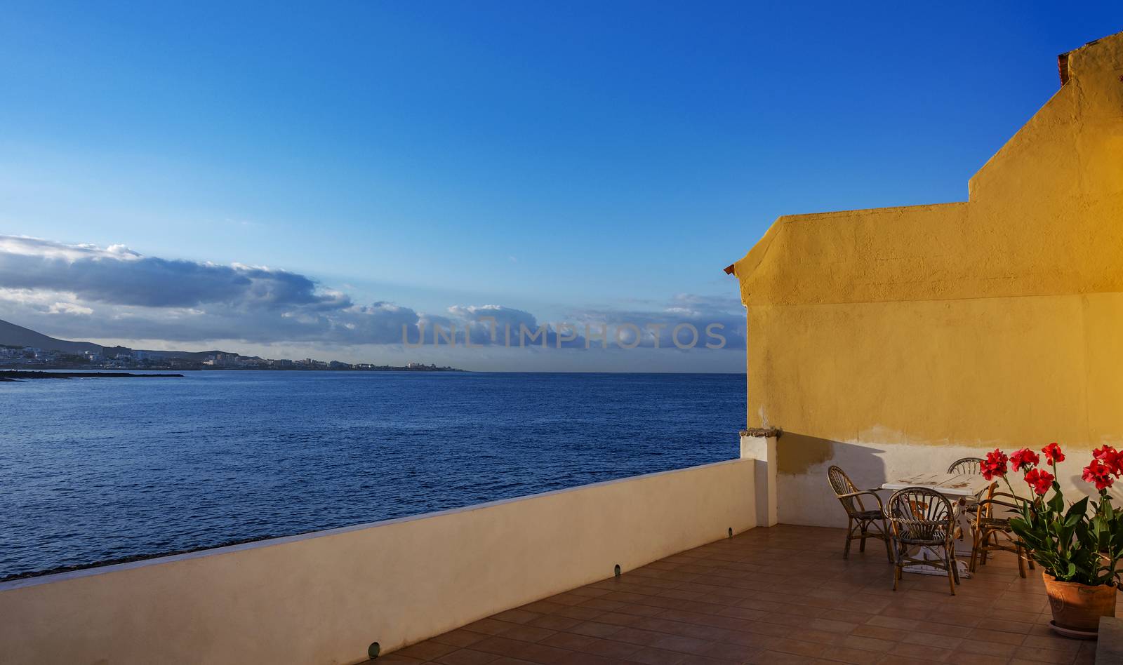 Verandah overlooking the ocean coast by Grommik