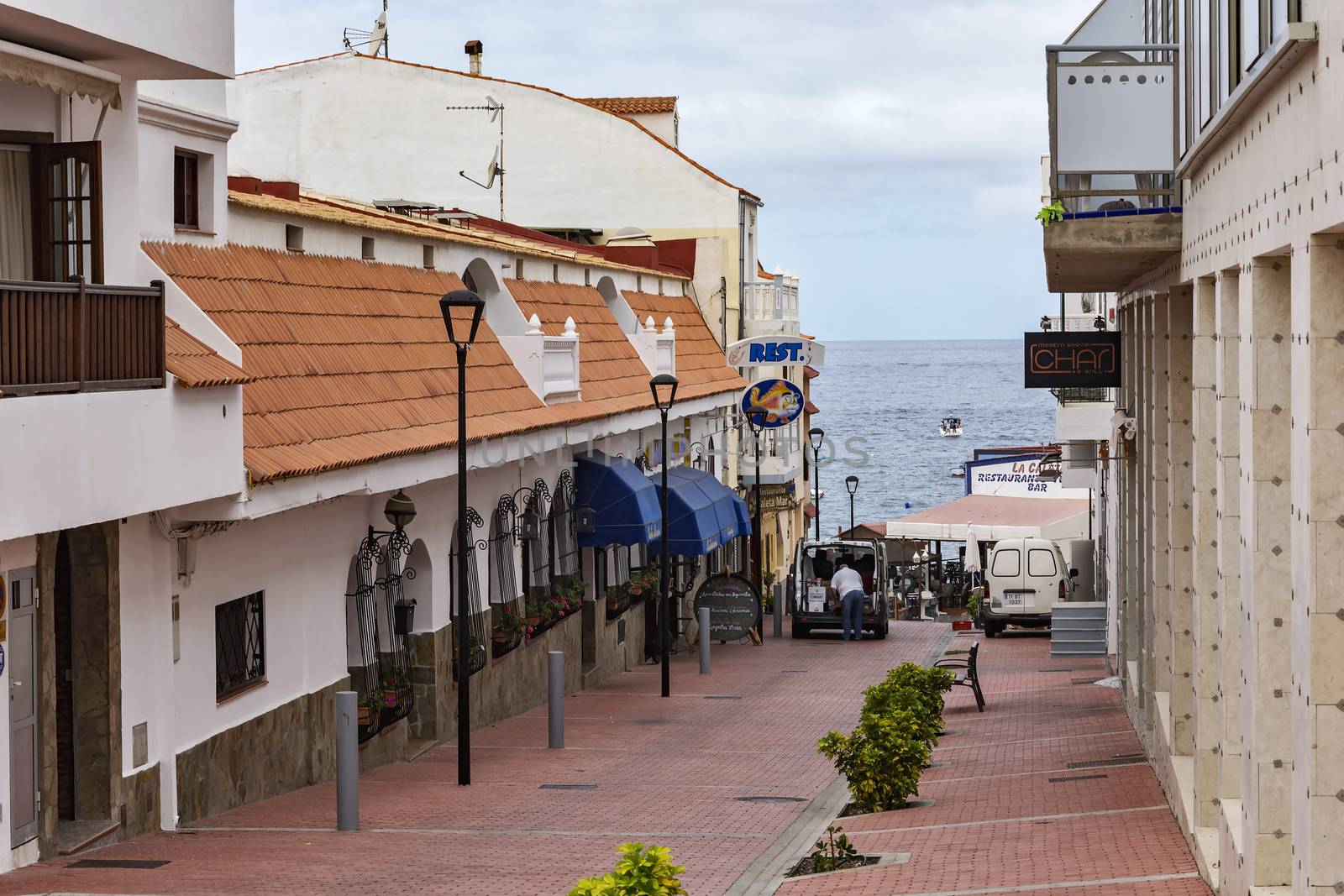 Spain, Tenerife - 10.09.2016: La Caleta village street leading to the shore of the ocean