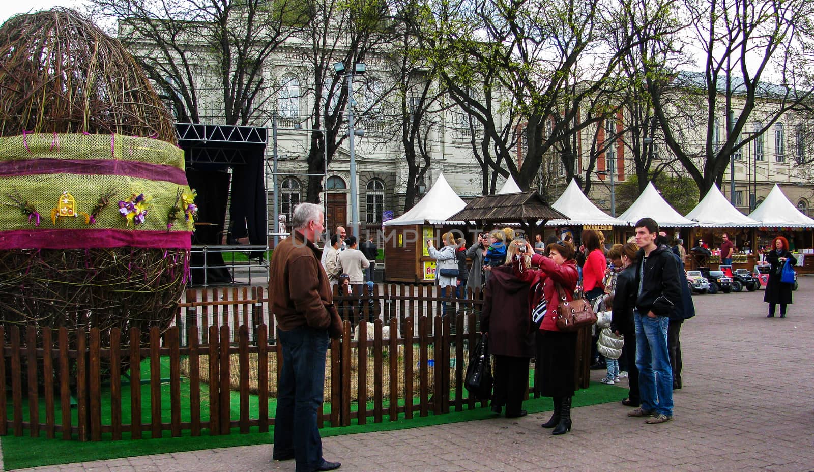 A woman photographs the man on the street by Grommik