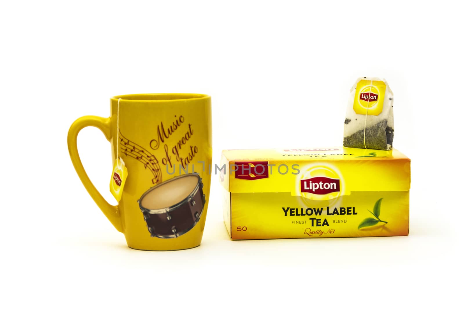 Yellow mug and tea bag packing with Lipton