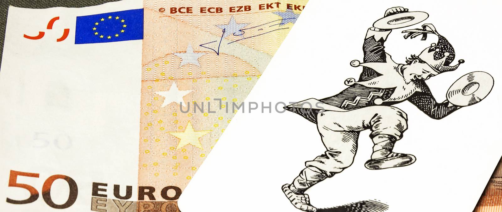 Some cards with the image of the joker is on a part of fifty euro banknotes