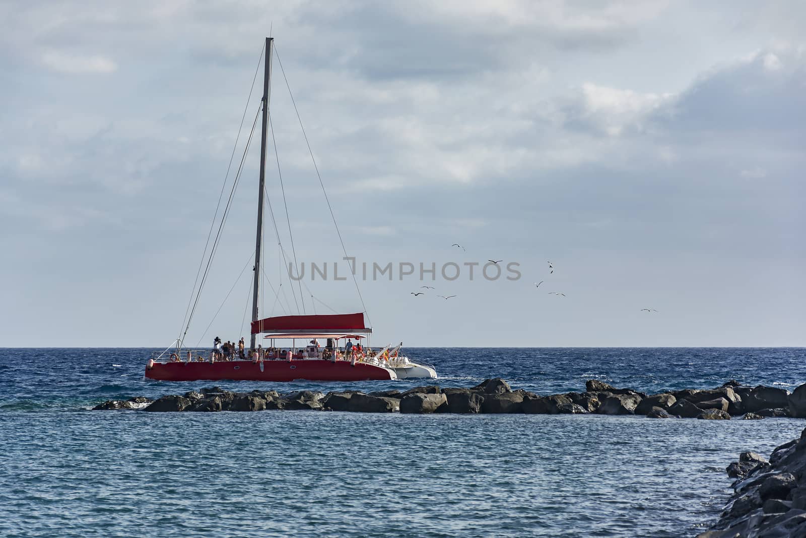 By Sea stones along the sails sailing catamaran by Grommik