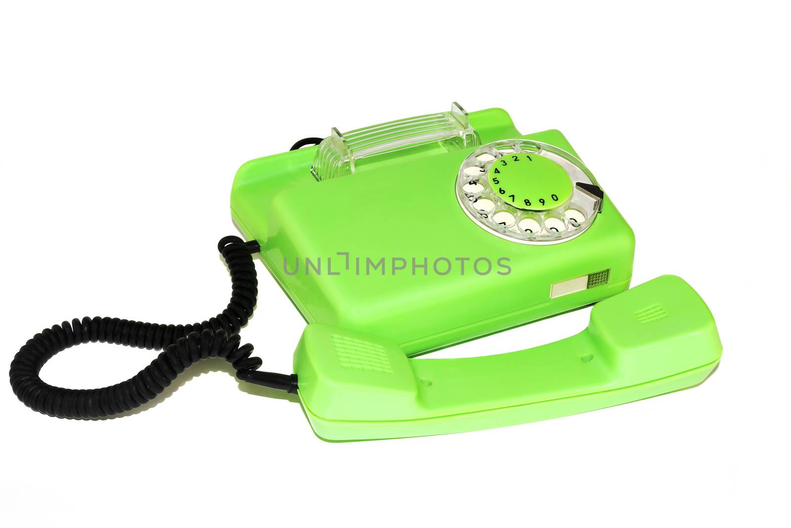 On a white background is an old telephone with a round dialer