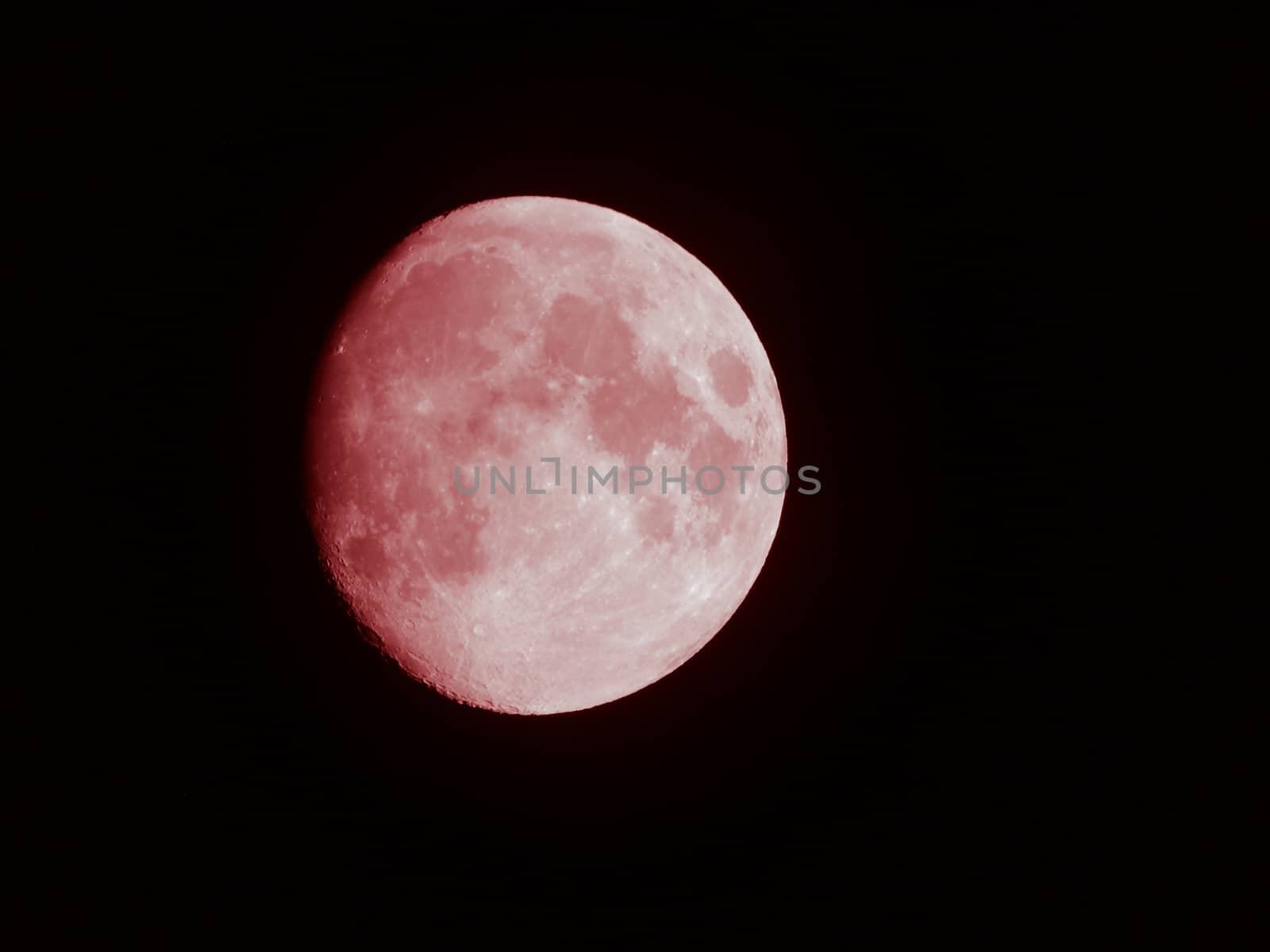 Liguria, Italy - 07/22/2020: Beautiful photography of the moonlight in the different phases with different colours. Black sky and little stars in the background.