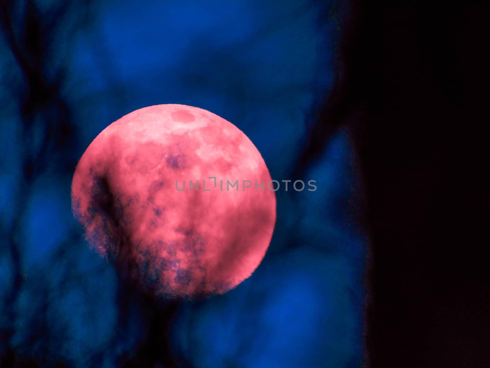 Liguria, Italy - 07/22/2020: Beautiful photography of the moonlight in the different phases with different colours. Black sky and little stars in the background.