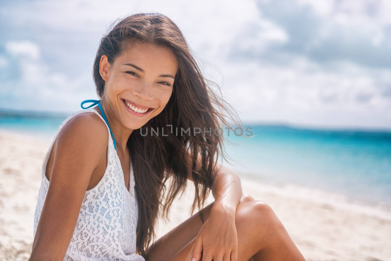 Happy healthy Asian woman smiling on beach vacation lifestyle. Young multiracial chinese girl relaxing in summer outdoor travel holidays. Portrait of beautiful lady in tropical background by Maridav