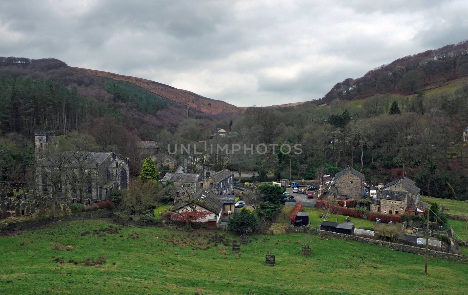 the village of cragg vale in calderdale west yorkshire showing the church and houses between high pennine hills