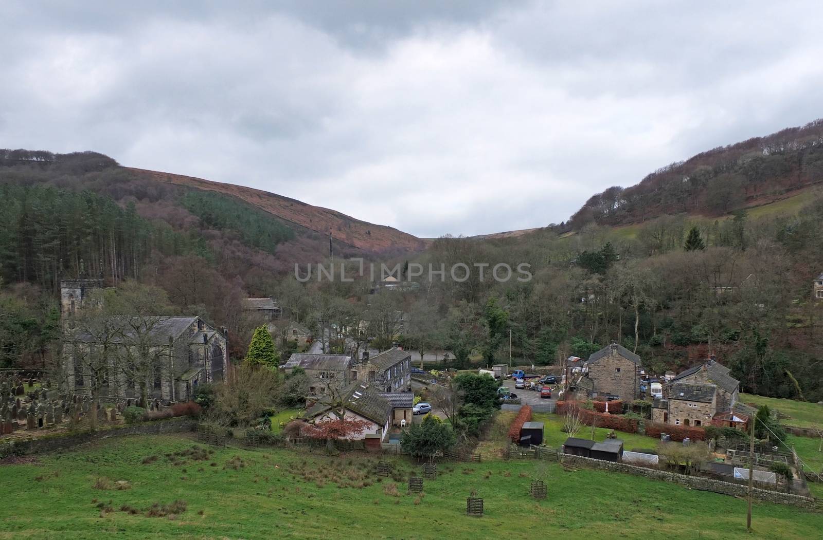 the village of cragg vale in calderdale west yorkshire showing the church and houses between high pennine hills