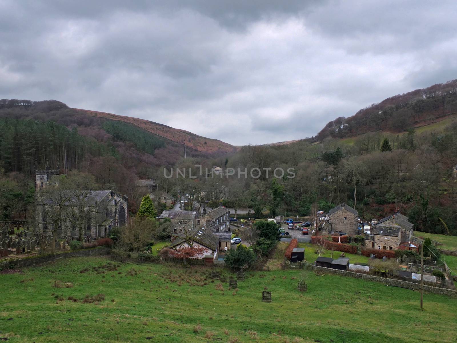 the village of cragg vale in calderdale west yorkshire showing the church and houses between high pennine hills