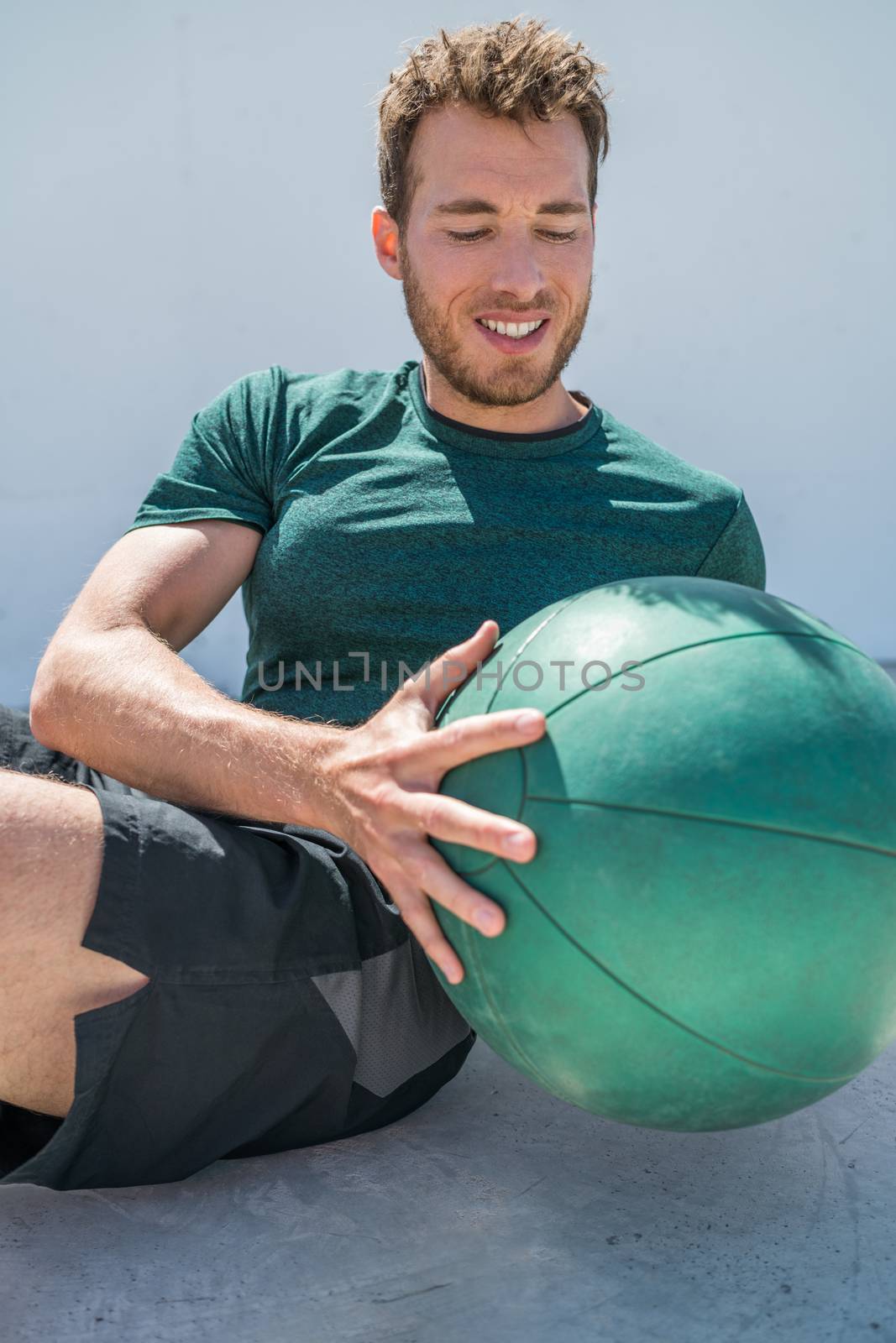 Gym workout with medicine ball exercise man by Maridav