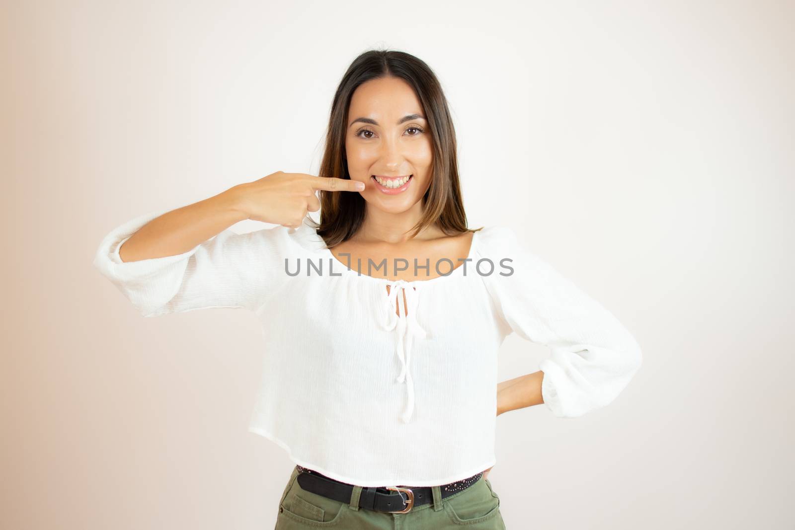 Beautiful young woman in white shirt gesturing by lmstudio