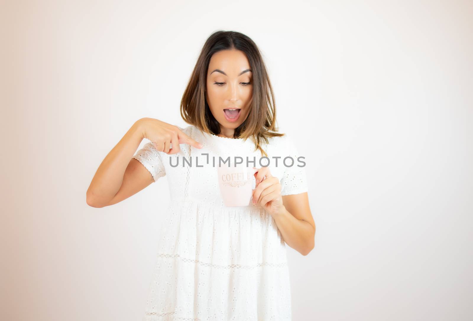 Beautiful young woman with a cup of coffee