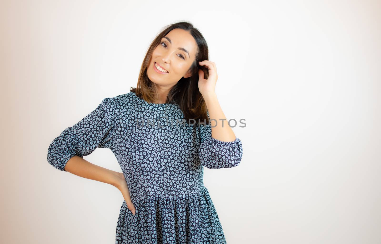 Beautiful woman in blue dress smiling by lmstudio