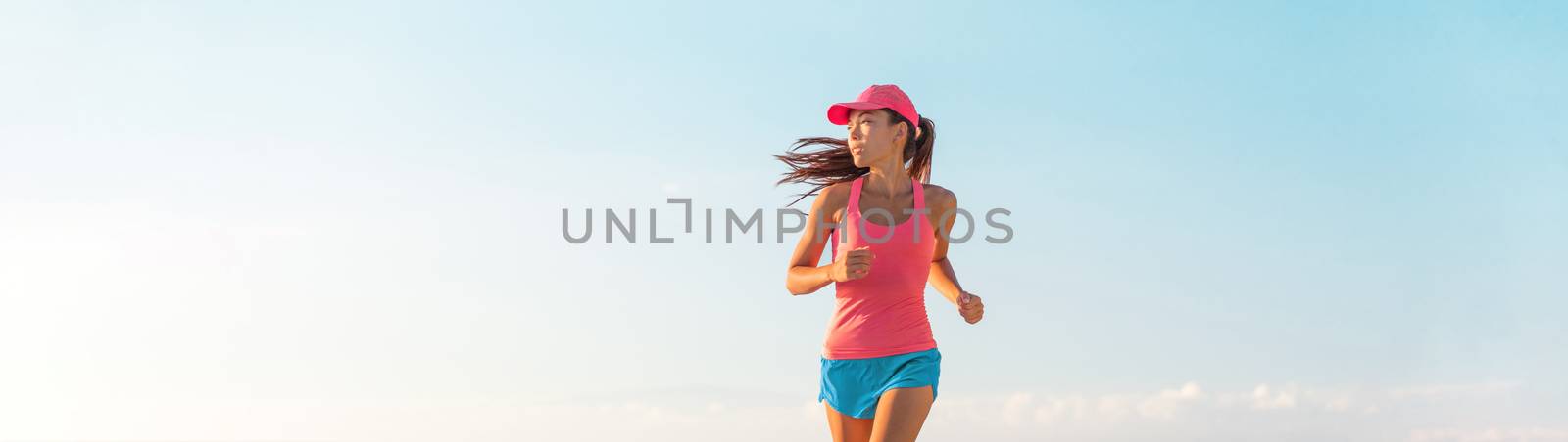 People lifestyle banner healthy woman running. Blue sky copyspace by Maridav