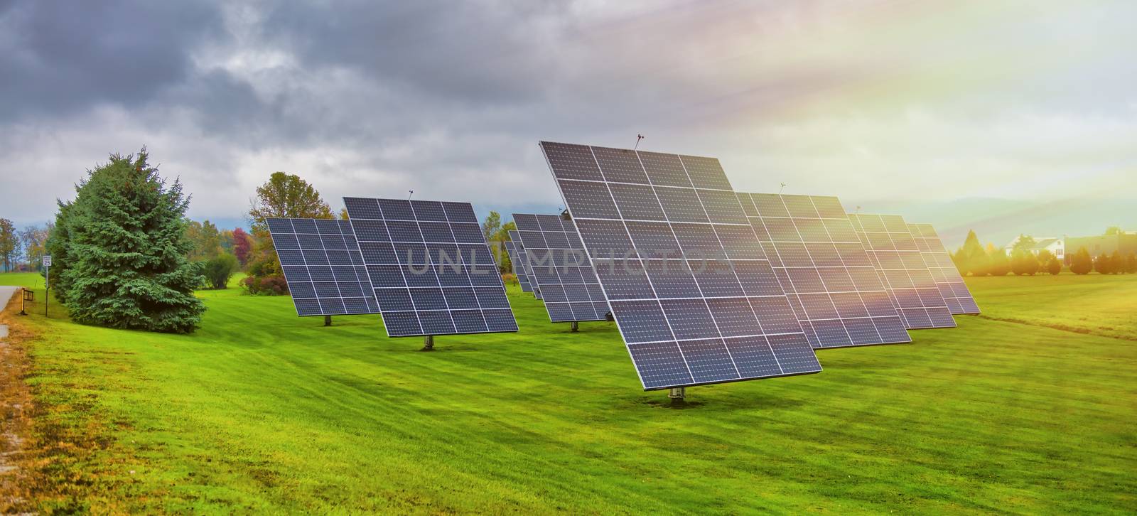 Solar panels at sunrise with cloudy sky in the countryside. Sola by jovannig