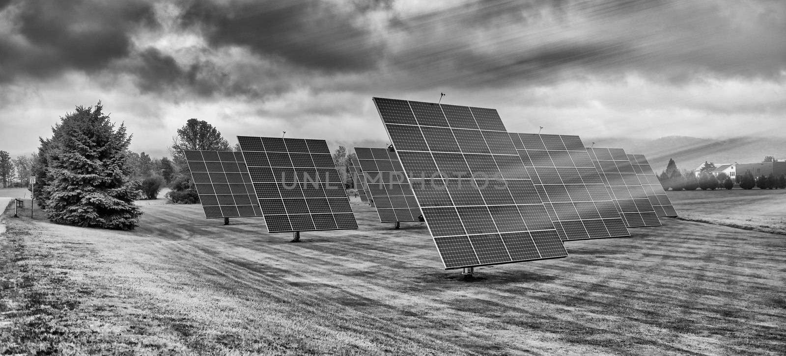 Solar panels at sunrise with cloudy sky in the countryside. Sola by jovannig