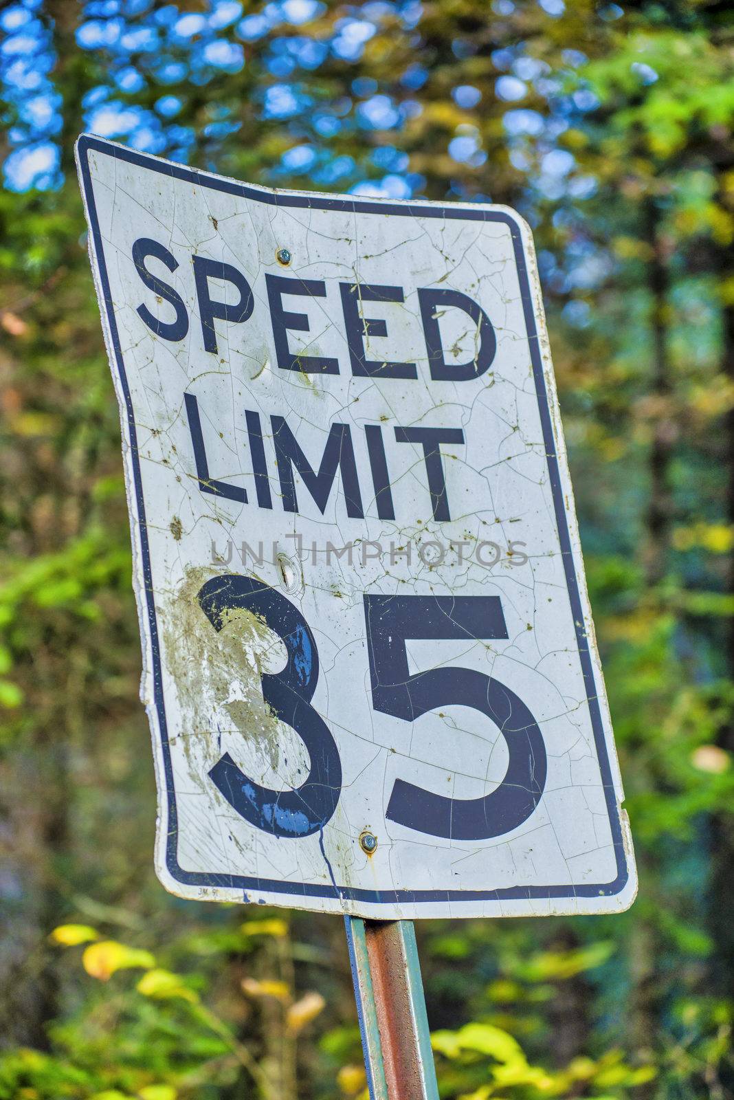 Speed Limit 35 Miles per Hour street sign in the woods by jovannig