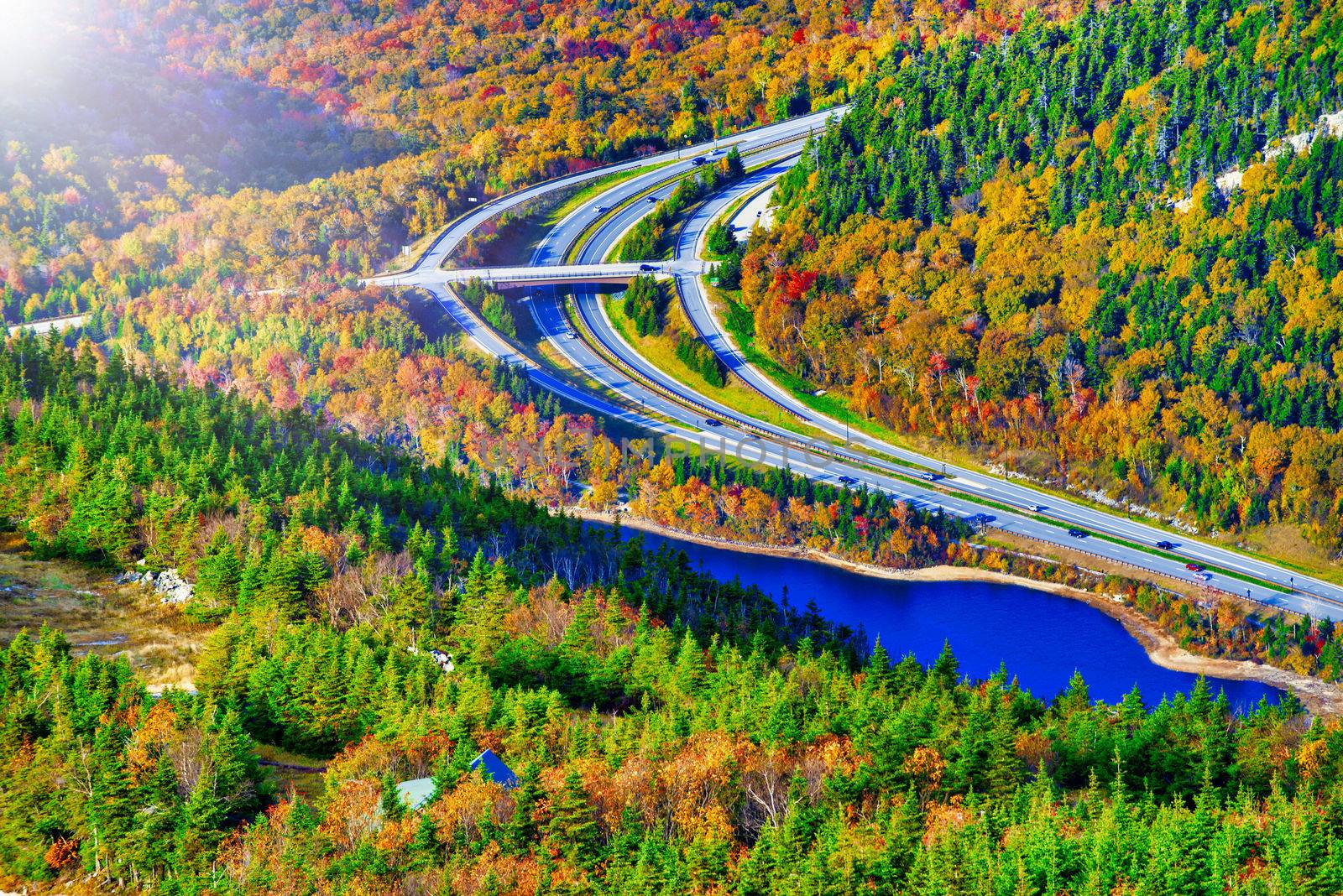 Road across New England countryside in foliage season, USA by jovannig