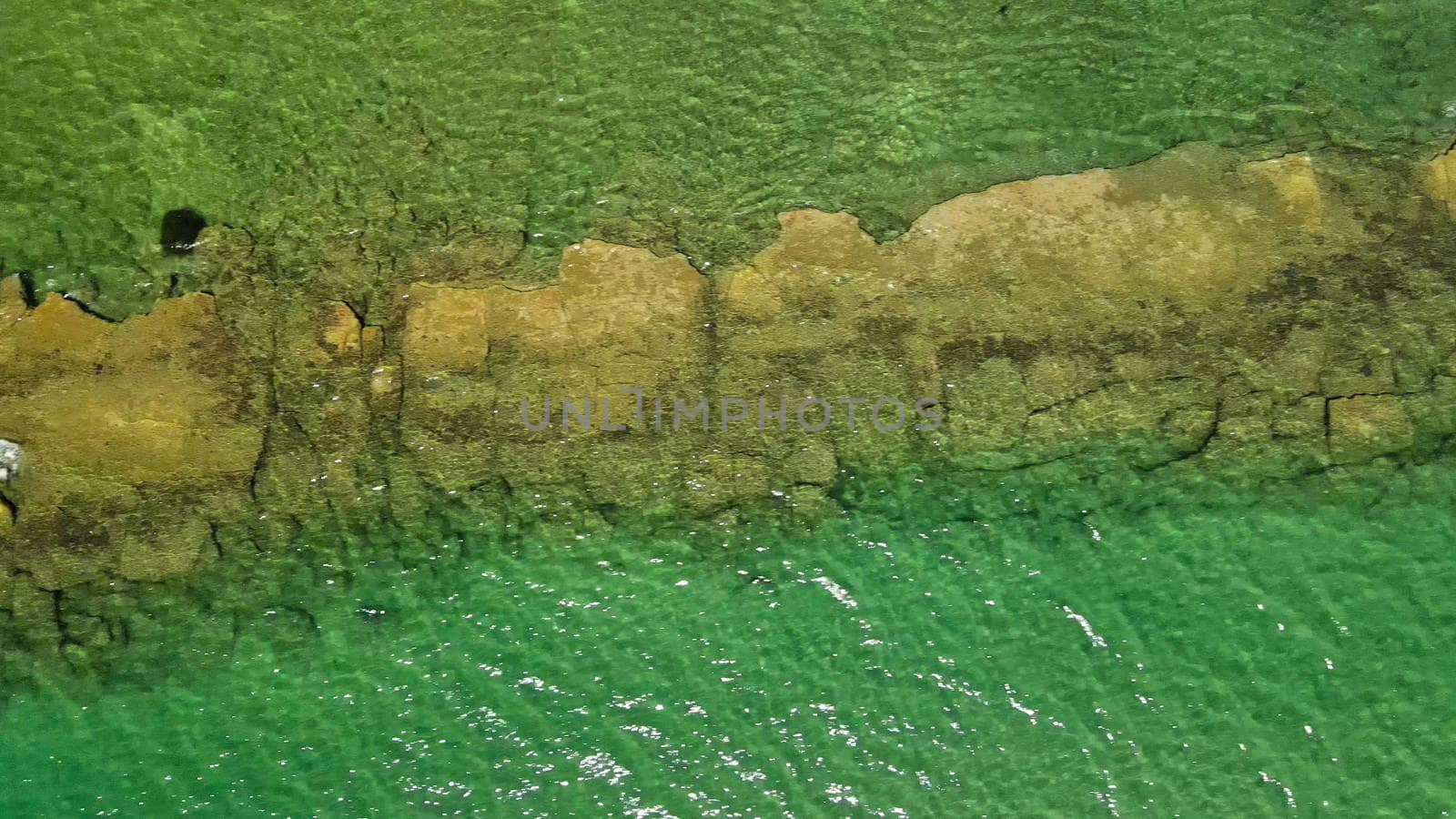 Ancient road in the ocean, old roman ruin. Aerial viewpoint