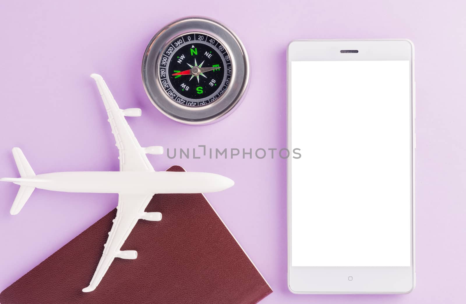 model plane, compass and modern smart mobile phone by Sorapop