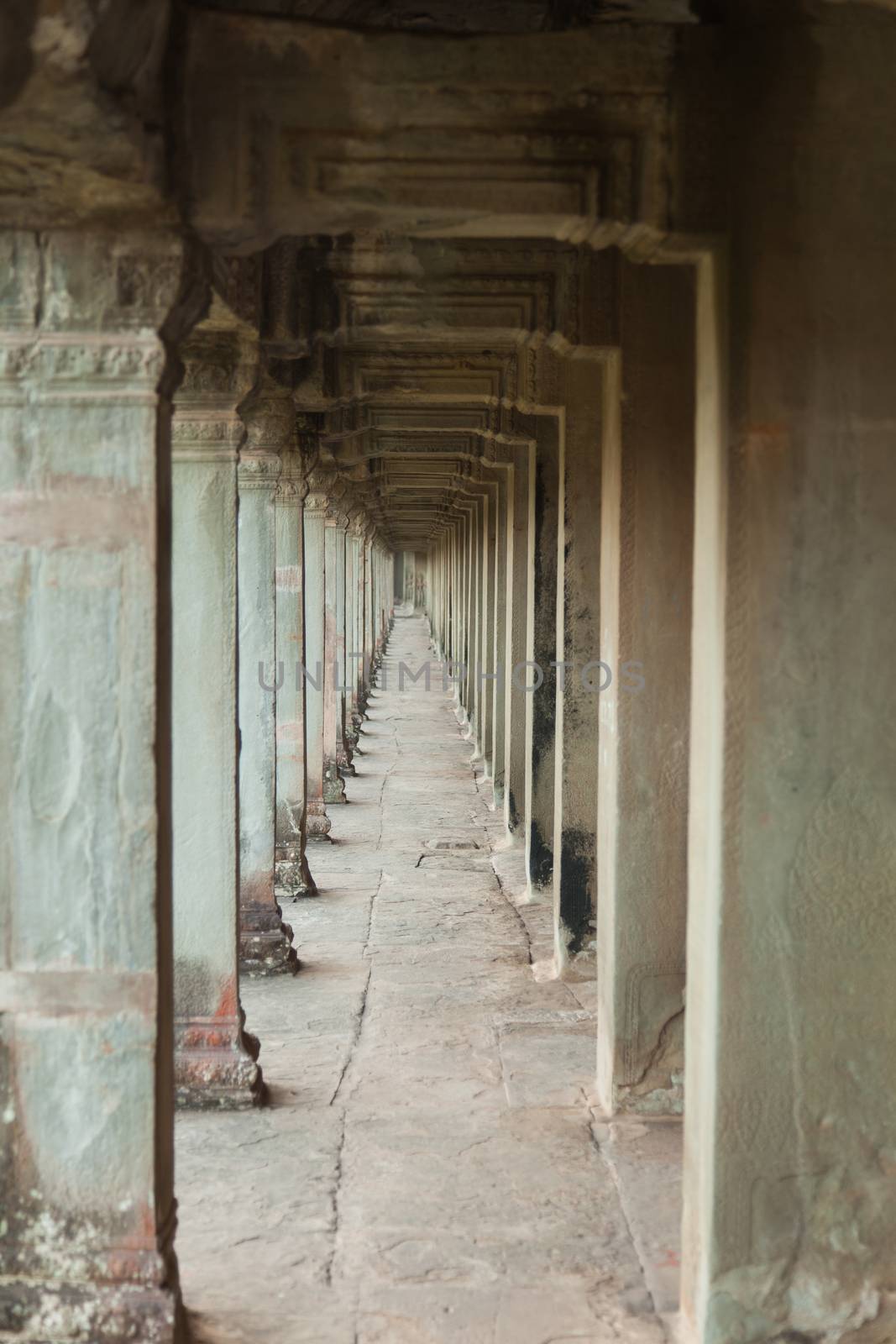 The temple complex of Angkor Watt, Cambodia, passageway with repeating arches by kgboxford