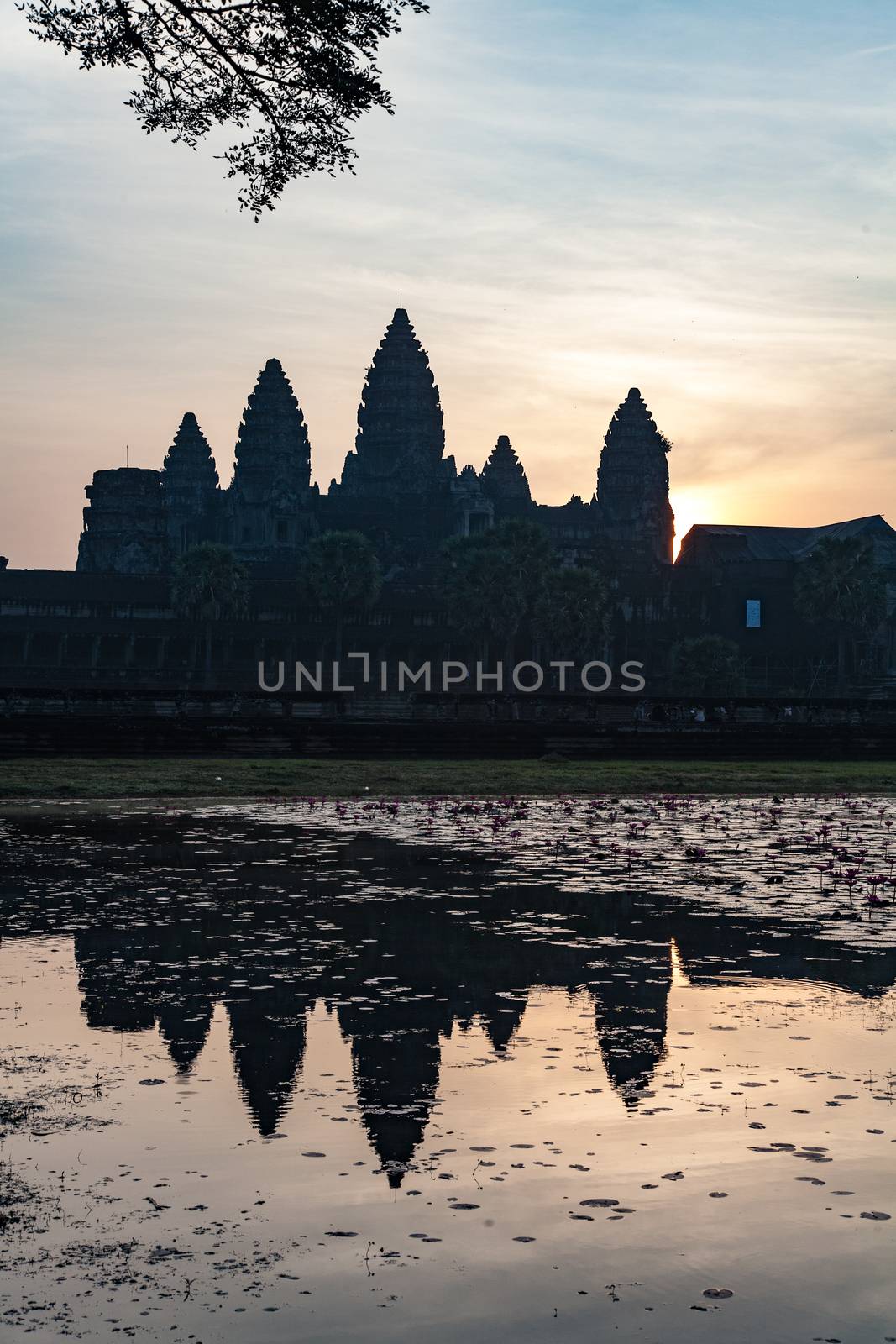The temple complex of Angkor Watt, Cambodia, at dawn with reflection in lake by kgboxford
