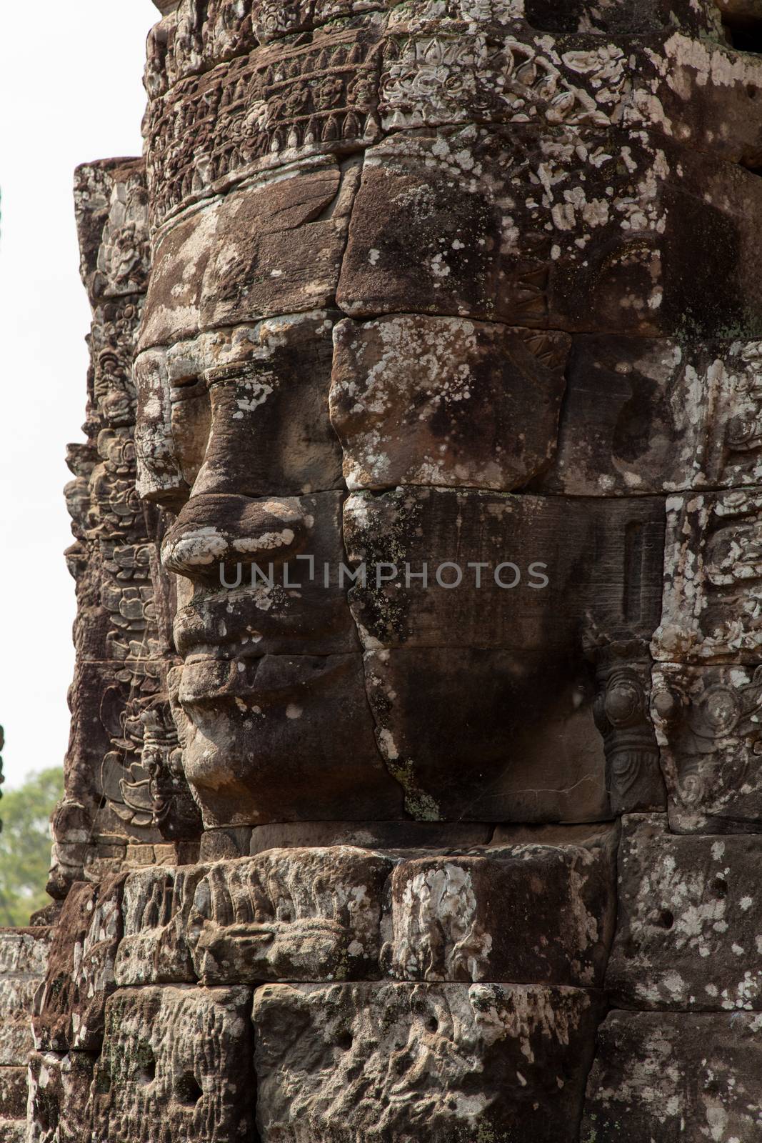 The Bayon is a temple at Angkor in Cambodia with the huge faces of Jayavarman  by kgboxford