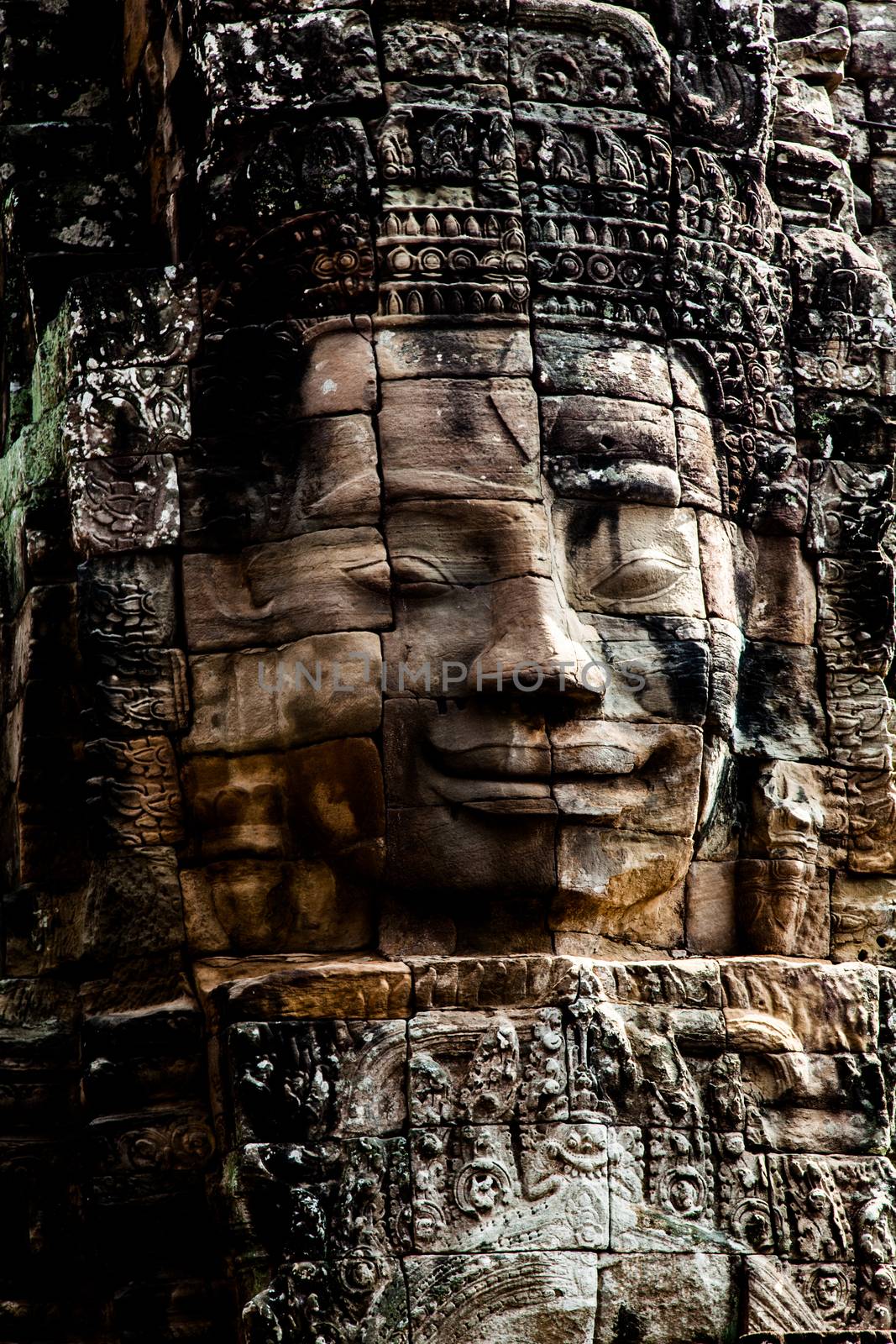 The Bayon is a temple at Angkor in Cambodia with the huge faces of Jayavarman  by kgboxford